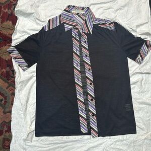Vintage sheer short-sleeved shirt with colorful striped accents.